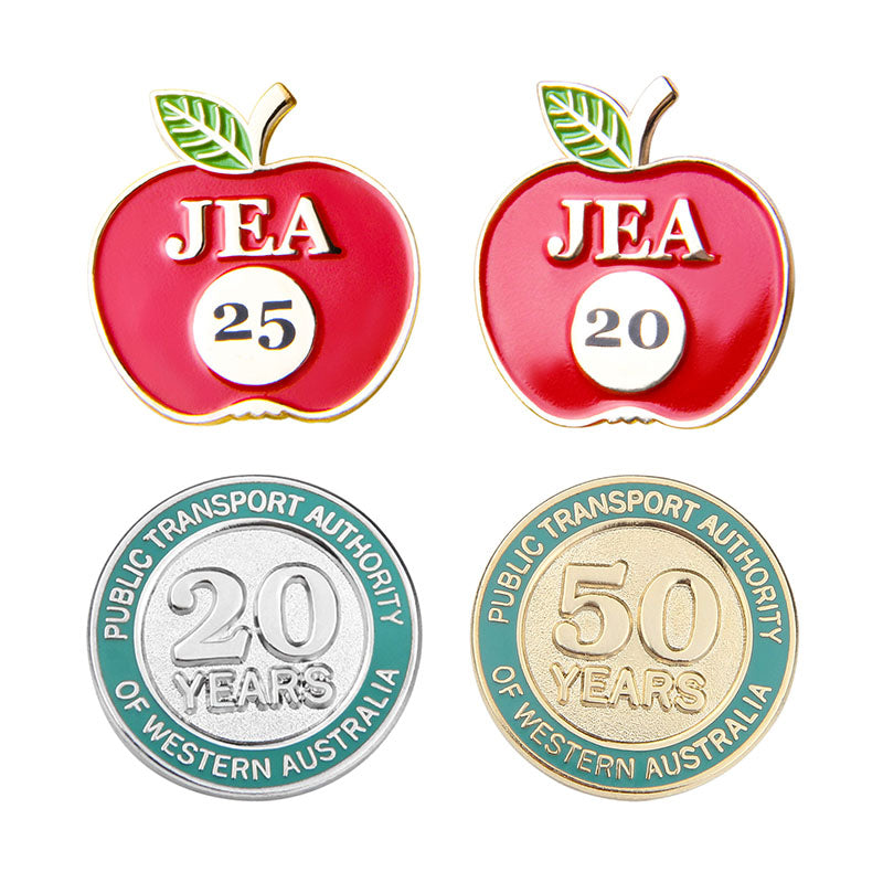 Custom Employee Award Pins for JEA and Public Transport Authority Featuring Red Apple and Silver Gold Circular Designs with 3D Raised Text Celebrating Years of Service Recognition