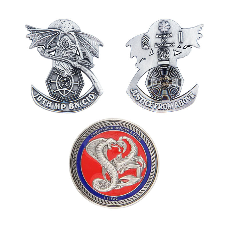 Three antique plating coins arranged in a triangle, featuring custom text and designs like a hooded figure with a scythe, wings, and serpents on silver coins with red and blue accents.