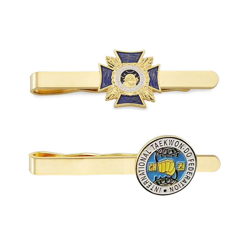 Custom gold tie bars featuring two designs with blue enamel accents, star borders, and examples of custom text for personalization.