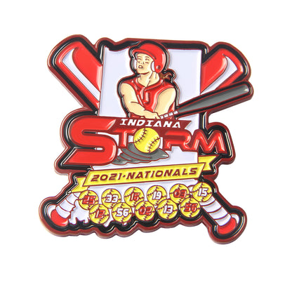 Custom baseball trading pin featuring a female batter in red, crossed bats, and yellow baseballs with numbers, with custom "Indiana Storm" and "2021 Nationals" text.