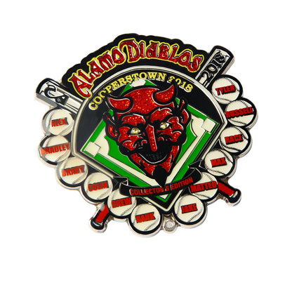 Custom baseball trading pin for the Alamo Diablos team, featuring a red glitter devil head with gold horns on a green diamond infield, player names on baseballs, with team name and Cooperstown 2018 text.