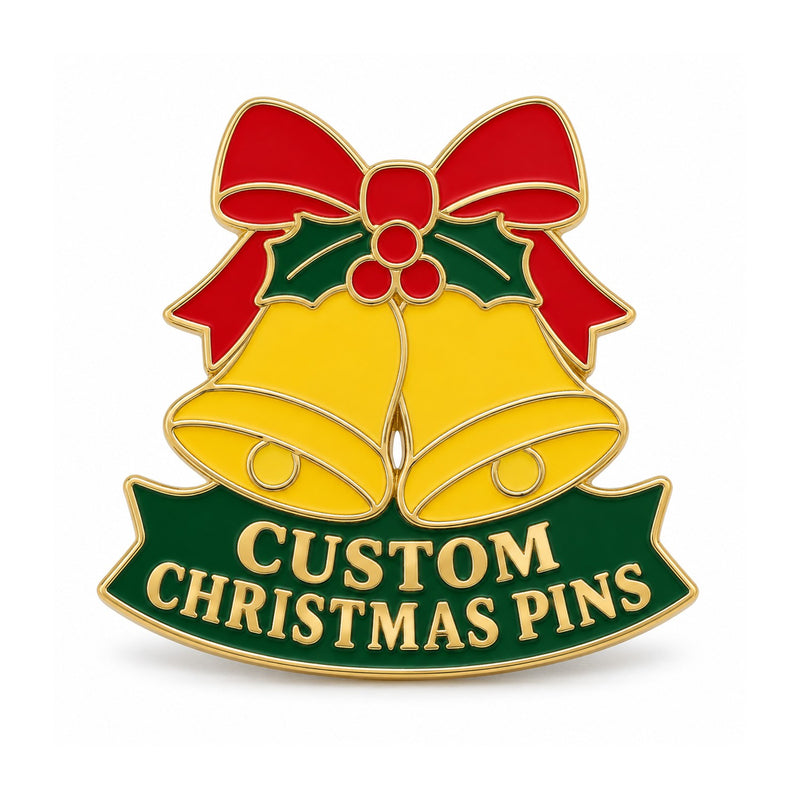 Gold Christmas bell enamel pin with red bow and green banner on white