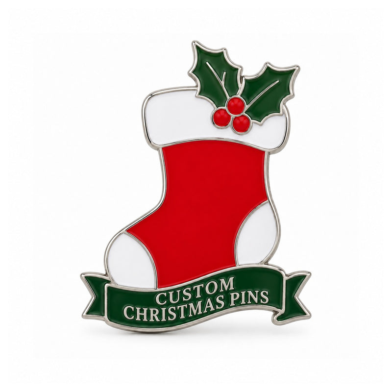 Red Christmas stocking enamel pin with holly leaves on a white background