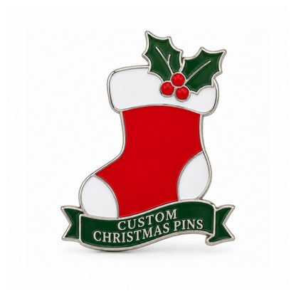 Red Christmas stocking enamel pin with holly leaves on a white background