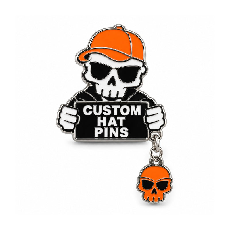 Skull custom hat pin with orange cap and matching dangling charm on white