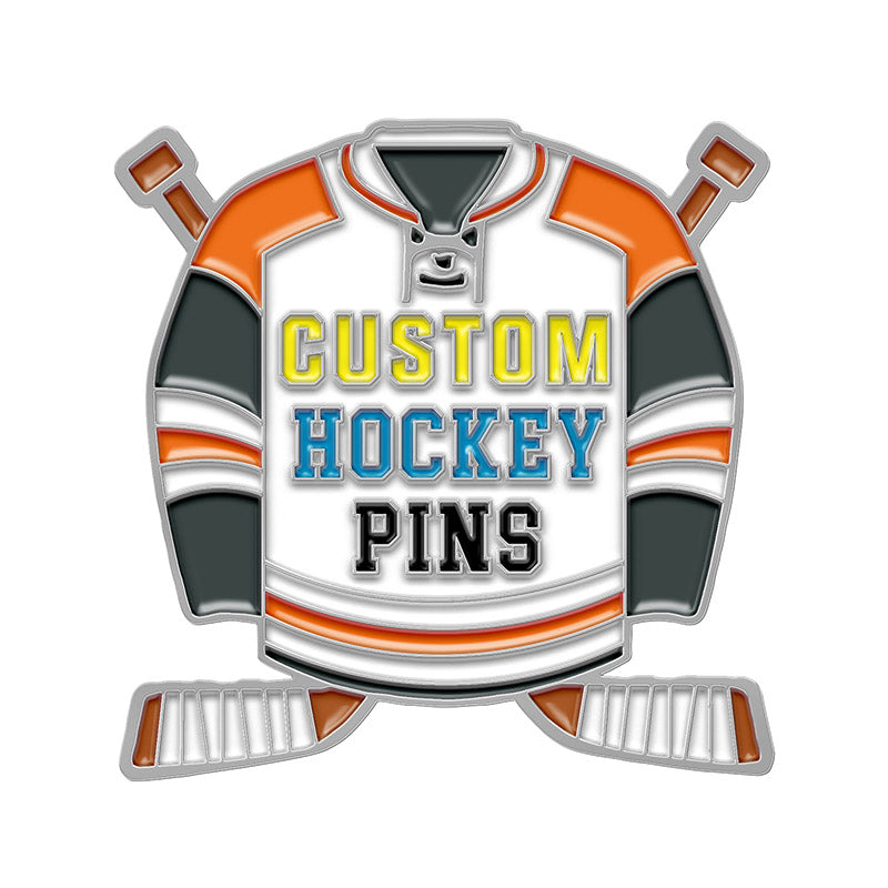 Custom hockey trading pin template shaped like a white and orange jersey with crossed brown and silver sticks, featuring example text to showcase custom lettering areas.