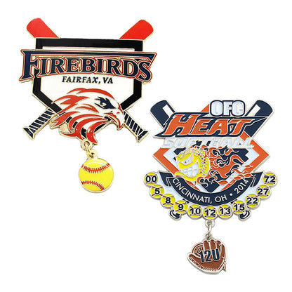Two custom dangle charms softball trading pins featuring team designs with contrasting color schemes, mascot imagery, and numbered baseballs, all with custom text.