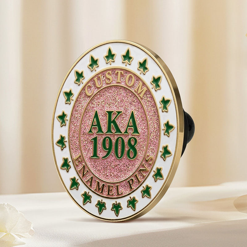 Gold finish alpha kappa alpa sorority sister lapel pins viewed from the side to display edge details.