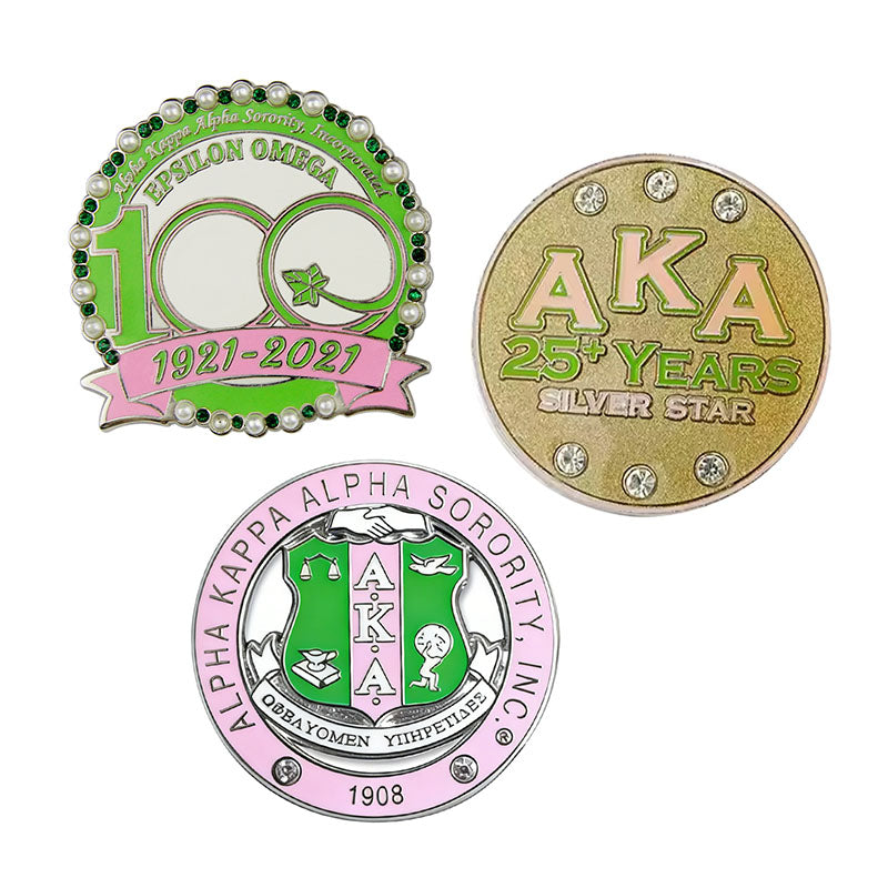 Three custom AKA lapel pins displaying premium rhinestone and pearl details for milestone anniversaries.