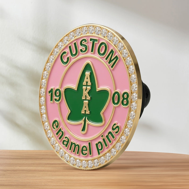 Side view of a custom Alpha Kappa Alpha sorority pin with a rhinestone border, showing its thickness and clutch back.