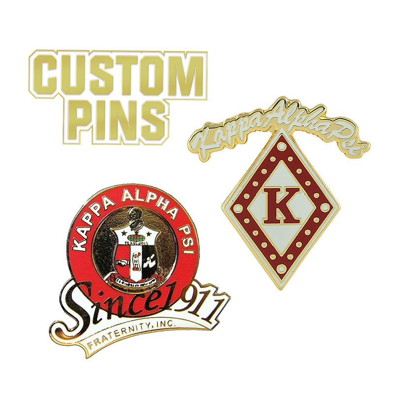 An assortment of custom Kappa Alpha Psi enamel pins, including a circular fraternity crest design with Since 1911 text and a diamond-shaped K pin.