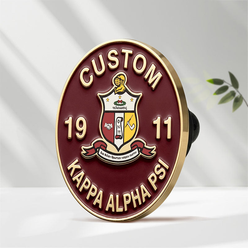 Side view of a circular custom Kappa Alpha Psi gold pin, showcasing the pin clutch.