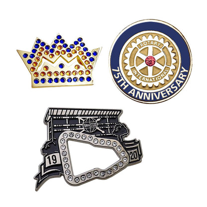 Custom enamel pins with rhinestones showcasing a Gold crown badge corporate anniversary emblem and Silver sports arena design
