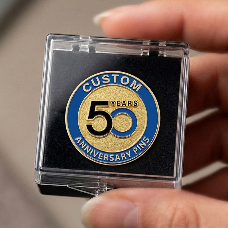 50th anniversary pin in a clear case held by a hand