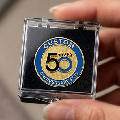 50th anniversary pin in a clear case held by a hand