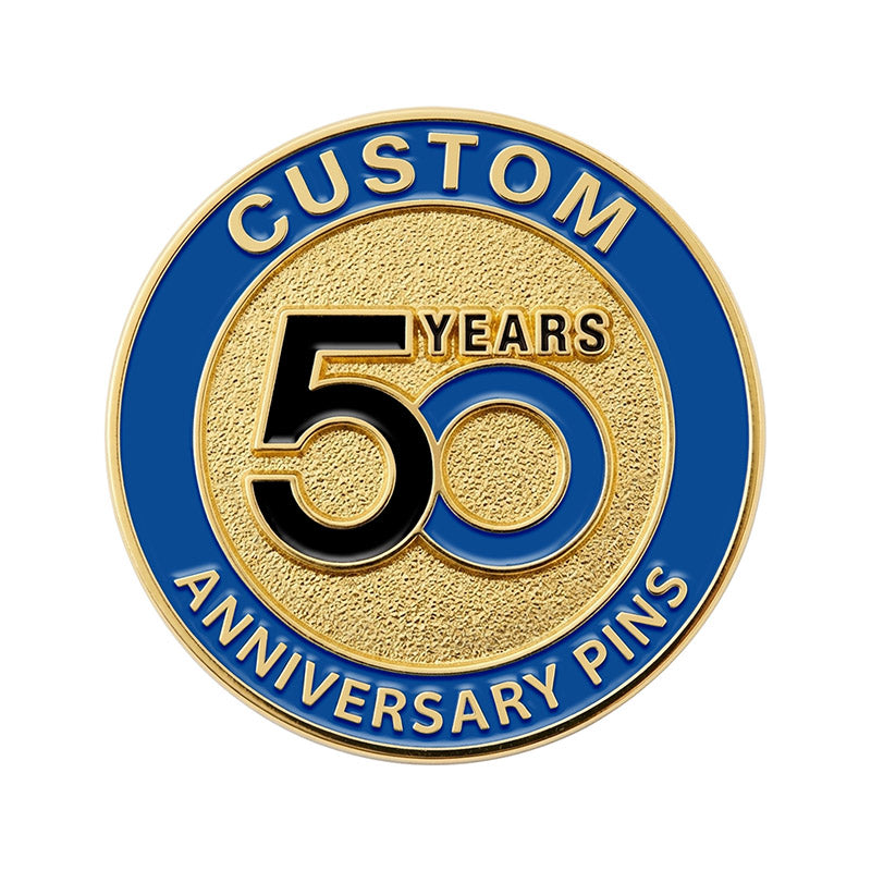 A custom round 50th anniversary lapel pin in gold tone, featuring a textured golden center with a black and blue interlocking 50 design and a royal blue enamel text border.