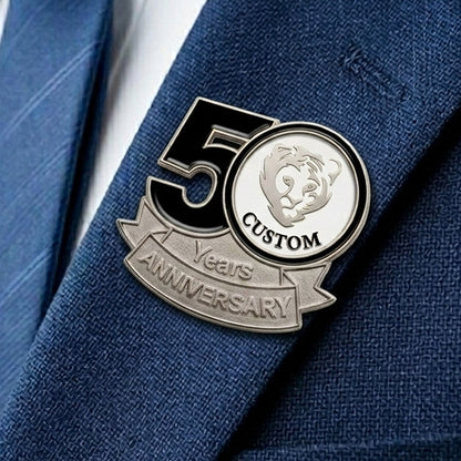 50th anniversary lapel pin on a blue suit jacket