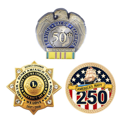A display of three custom anniversary badges, featuring an eagle-topped Vietnam War 50th service pin, a gold-tone multi-pointed star Lions Clubs governor badge with rhinestone accents, and a round 250th commemorative America's Navy pin.