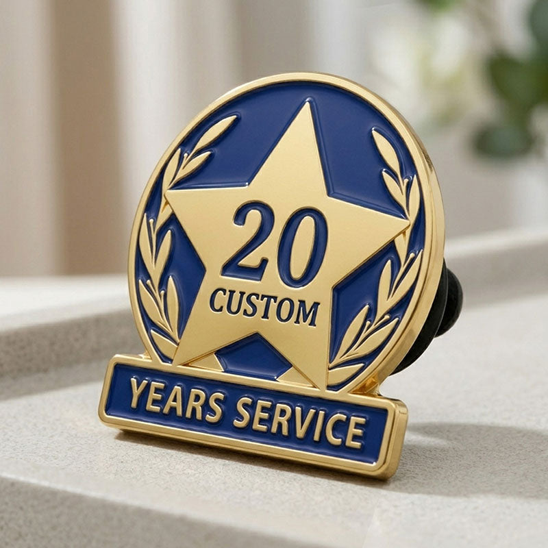 Side view of a gold service pin with blue enamel and a 20 years star design.