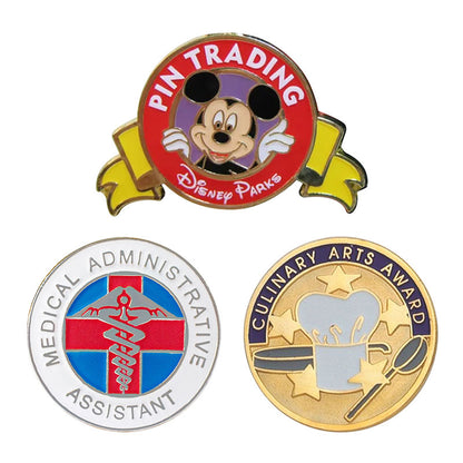 Custom enamel pins including Disney Parks trading pin, Medical Administrative Assistant badge, and Culinary Arts Award lapel pin