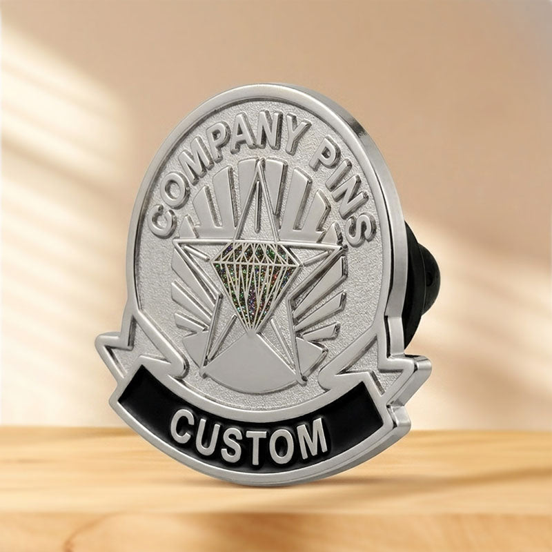 Side view of a silver tone corporate logo lapel pin, showing the metal thickness and a customizable text ribbon banner for business milestones.