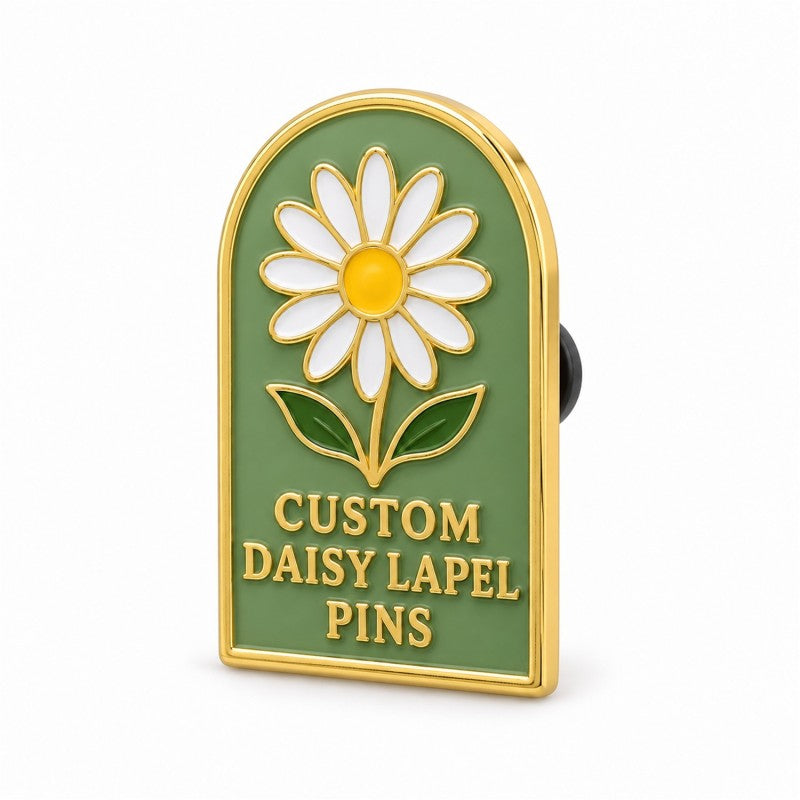 Side view of a gold-tone daisy lapel pin with green enamel and black clutch