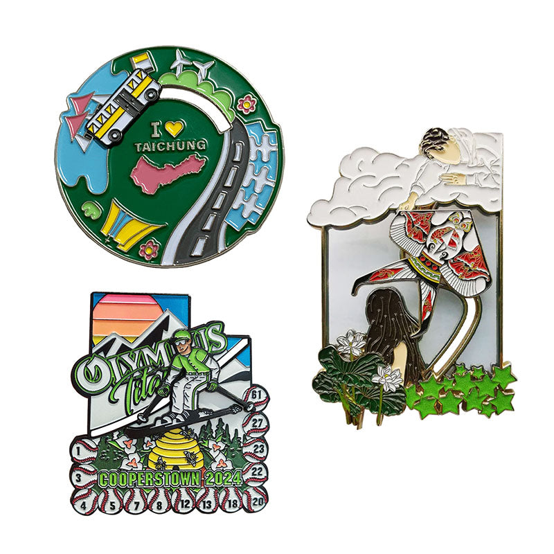 A collection of custom slider enamel pins showcasing movable elements, including a sliding bus on a circular track and an interactive skiing design.