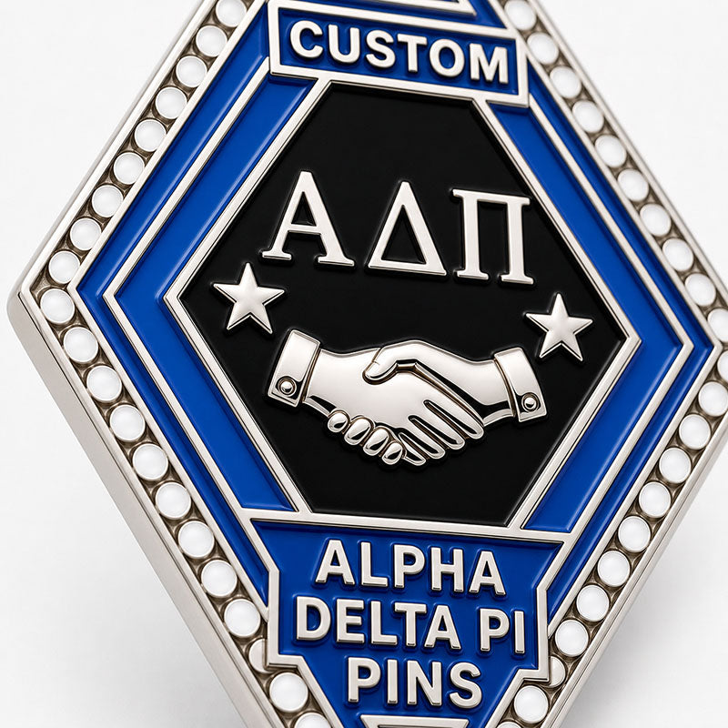 Close-up detail of alpha delta pi pins with polished metal lines and enamel colors