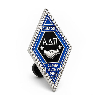 Side view of alpha delta pi pins showing metal edge thickness and pin backing