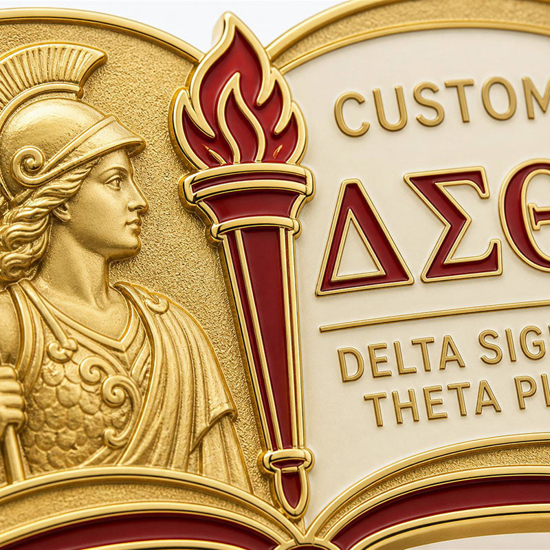 Close-up detail of delta sigma theta pins with polished metal lines and enamel colors