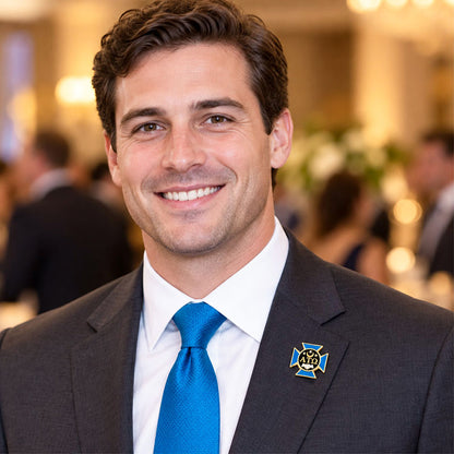 Custom Alpha Tau Omega pin worn on formal attire in a fraternity event setting