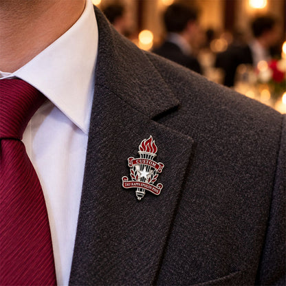 Custom Tau Kappa Epsilon pin worn on formal attire in a fraternity event setting