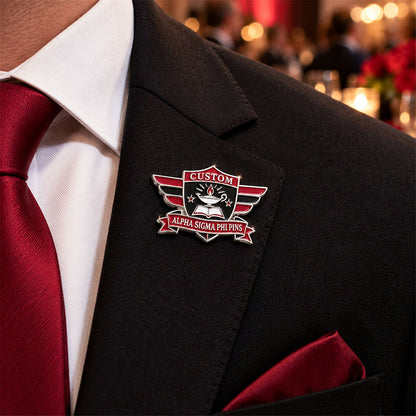 Custom Alpha Sigma Phi pin worn on formal attire in a fraternity event setting