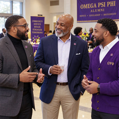 Custom Omega Psi Phi pin worn on formal attire in a fraternity event setting