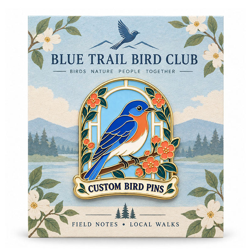 Blue songbird enamel pin displayed on a floral Blue Trail Bird Club backing card