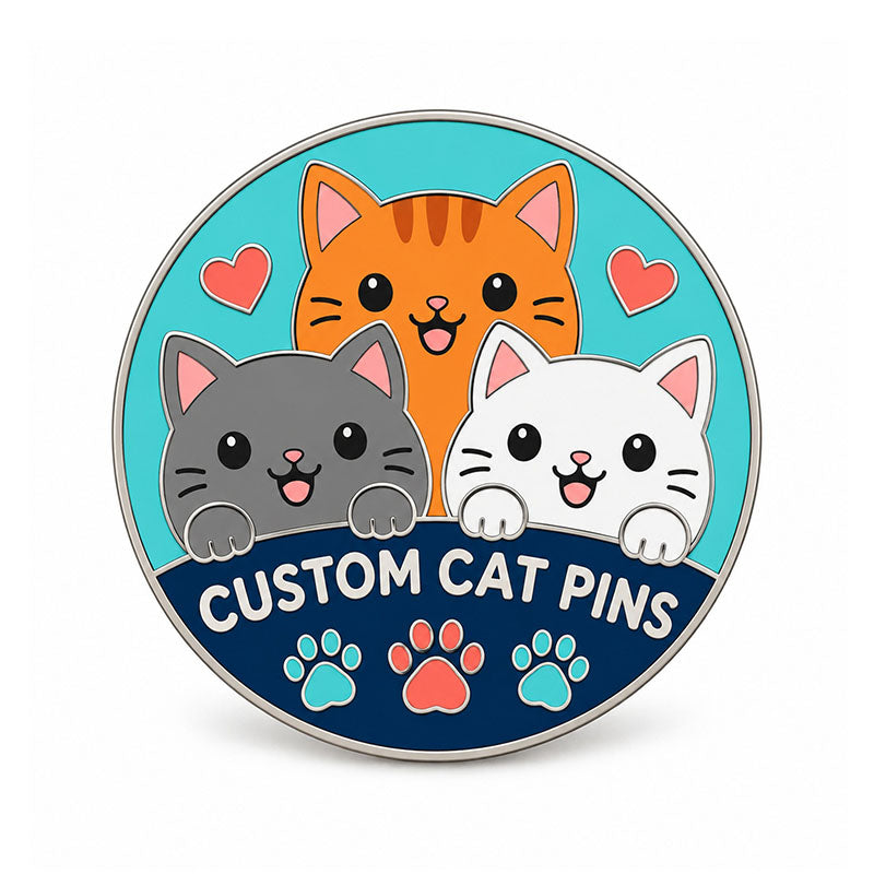 Round silver cat pin with three smiling cats, coral hearts, and teal paw details