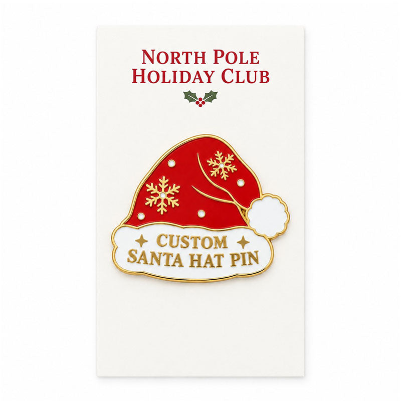 Red Santa hat enamel pin displayed on a white North Pole Holiday Club backing card