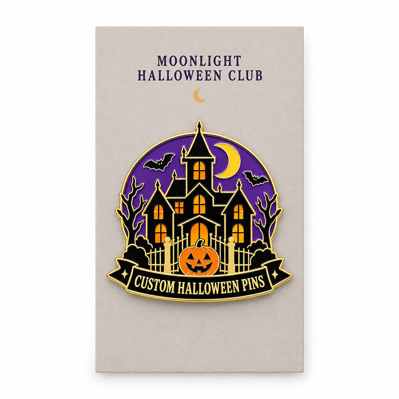 Haunted house enamel pin displayed on a Moonlight Halloween Club backing card