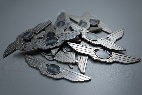 Pilot Aviation Wings Multiple Vintage Silver Wings Pins Stacked on Neutral Gray Background for Custom Design Comparison and Identification