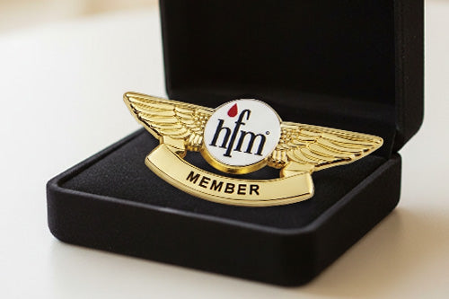 Custom Aviation Member Wings Pin Gold With Circular White Center Featuring Red Drop and Black hfm and MEMBER Text Presented in Black Velvet Gift Box for Professional Recognition