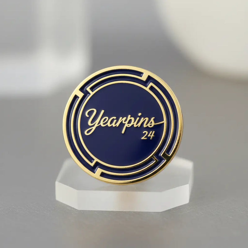 A premium corporate lapel pin with deep navy blue enamel fills and clean die struck gold plating lines featured on our enamel pins instagram feed.