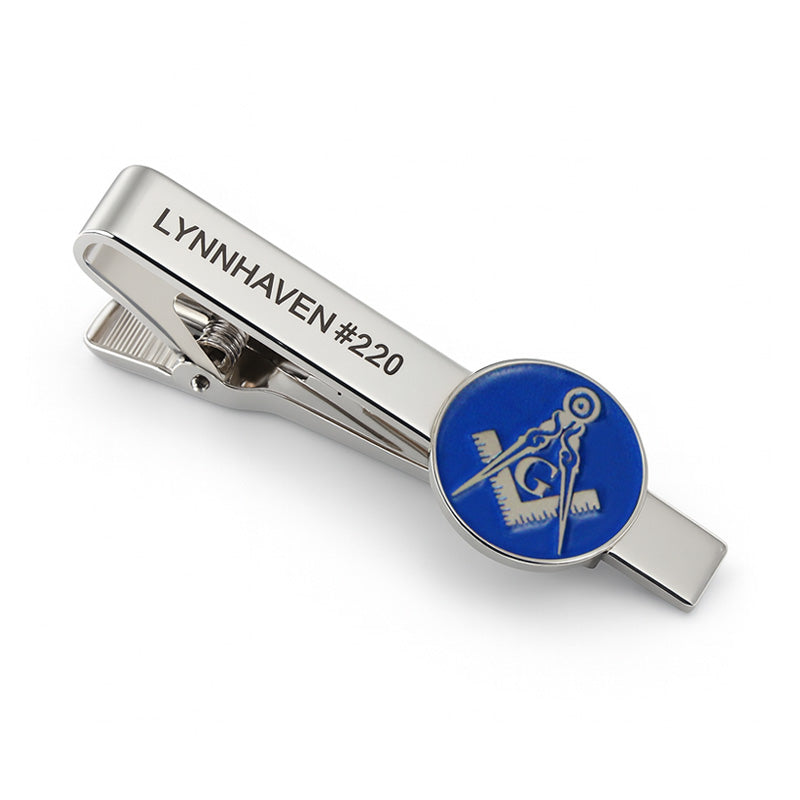 Custom silver tie clip with blue enamel emblem and Masonic design, featuring custom text. The product is now complete.