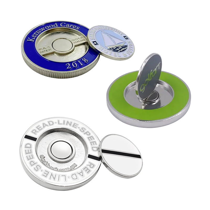 Custom golf ball markers with custom text, featuring metallic designs in silver, blue, and green colors