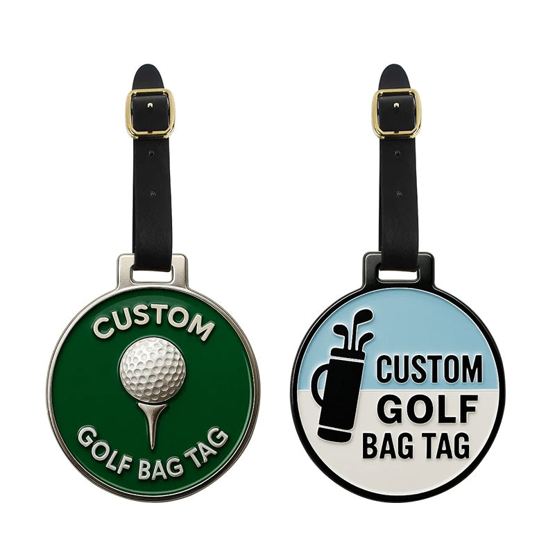 Two custom golf bag tags with circular metal designs and black leather straps, featuring custom text, one in green with white text and a silver golf ball motif, the other in light blue and white with black text and a golf bag pattern