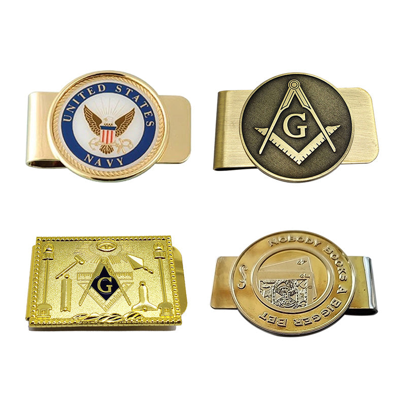 Display of four custom money clips, featuring designs with military, Masonic, and gambling themes, gold and bronze finishes, and examples of custom text.