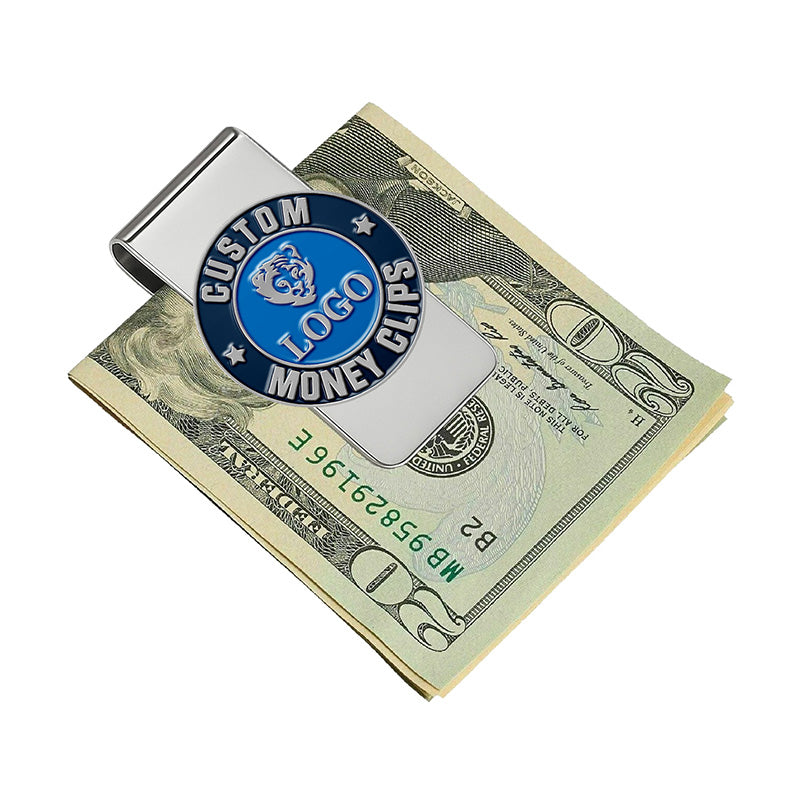 Custom silver money clip with blue enamel emblem, featuring custom text and a tiger design, shown clipping a stack of US $20 bills in a clean professional scene.