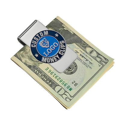 Custom silver money clip with blue enamel emblem, featuring custom text and a tiger design, shown clipping a stack of US $20 bills in a clean professional scene.