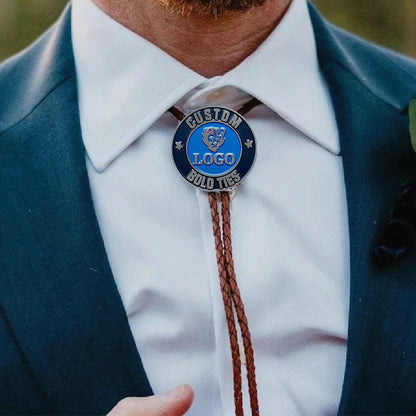 Custom bolo tie in a close-up scene, worn with a suit for a professional look, featuring engraved custom text and elegant design.