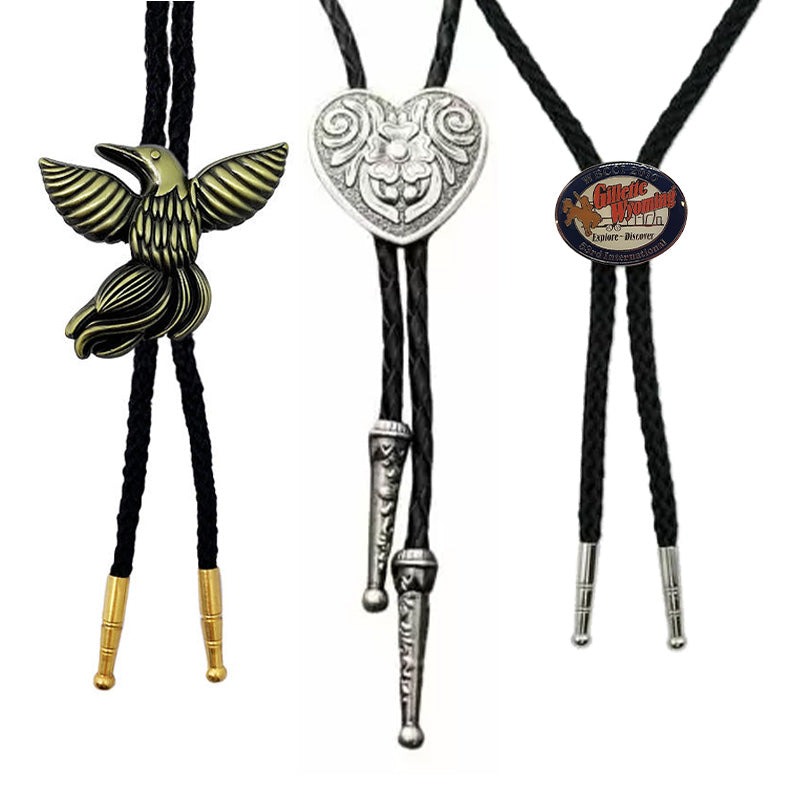 Show three custom bolo ties designs, including an eagle pendant in bronze, a heart shape with scrollwork, and a circular design featuring custom text, arranged on a white background for customization showca