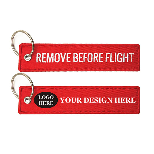 red remove before flight key tag with classic woven lettering